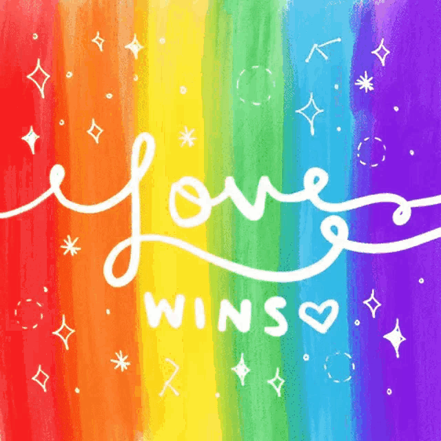 a rainbow background with the words love wins