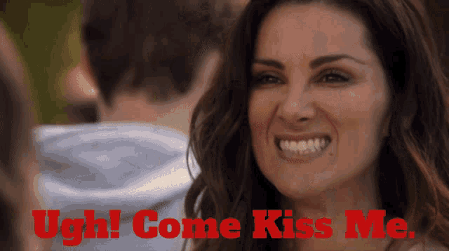 a woman is smiling with the words " ugh come kiss me " on the bottom