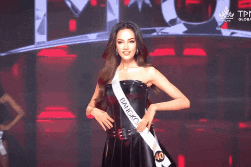 a woman wearing a sash that says bangi