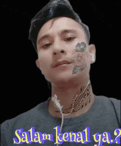a man with a tattoo on his face and the words salam kenal ga.
