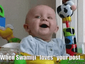 a baby is smiling with the words " when swamiji loves your post "