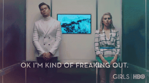 a man and a woman are standing next to each other with the words ok i 'm kind of freaking out