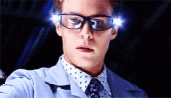 a close up of a man wearing glasses and a jacket