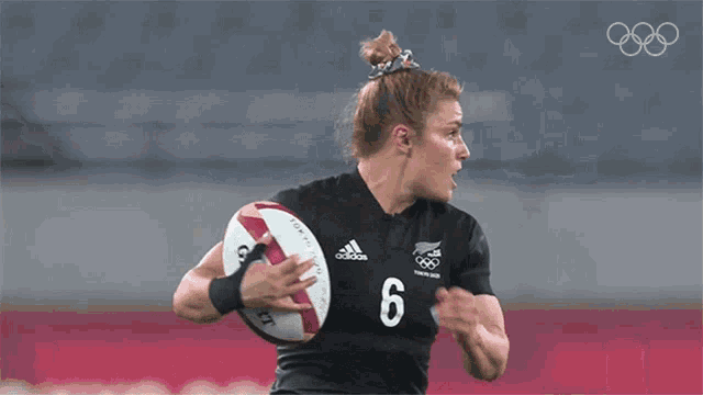 a female athlete with the number 6 on her shirt