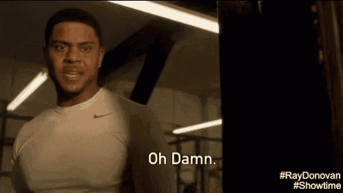 a man in a white shirt says oh damn in a gym