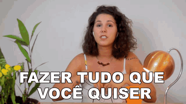 a woman wearing headphones says fazer tudo que voce quiser in a video