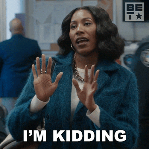 a woman says i 'm kidding with her hands up