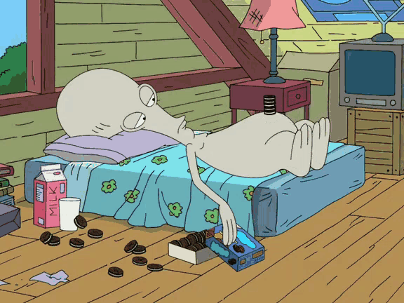 a cartoon of a man laying on a bed with a box of milk on the floor