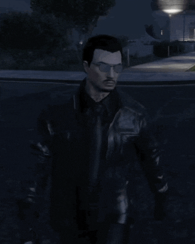 a man wearing glasses and a black leather jacket is standing in a parking lot