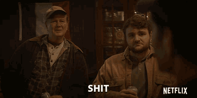 two men sitting next to each other with a netflix logo on the bottom
