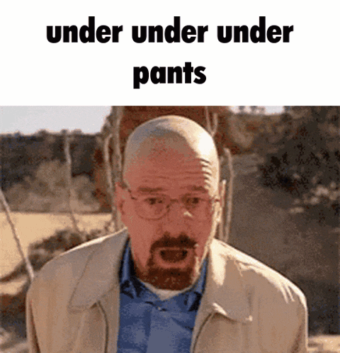 a bald man with glasses and a beard is standing in a field with the words under under under pants written above him