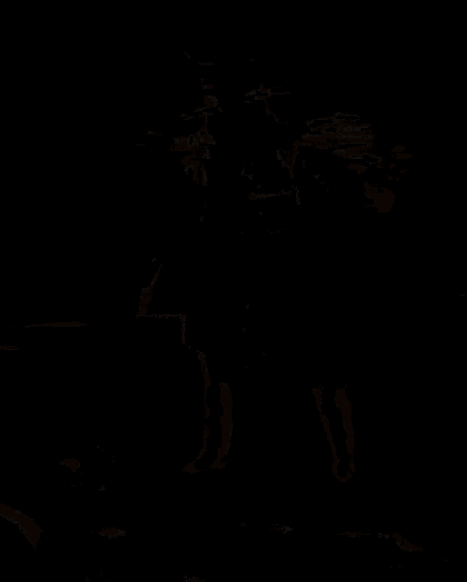 a man in a top hat is holding a shovel and a flashlight in a dark room .