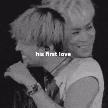 a black and white photo of two men with the words his first love written on the bottom