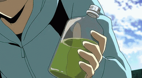 a man in a blue jacket is holding a bottle of green liquid