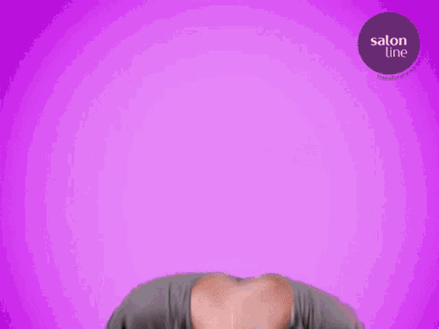 a woman 's head is visible in front of a purple background that says salon line
