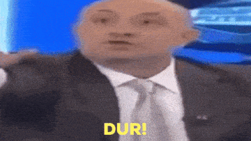 a man in a suit and tie is saying the word dur .