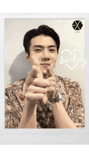a picture of a man giving a thumbs up with the word darling on the bottom right