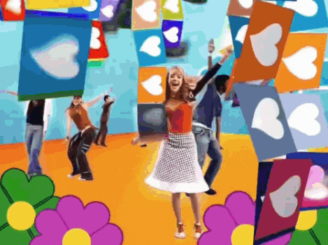 a woman is dancing in front of a bunch of hearts