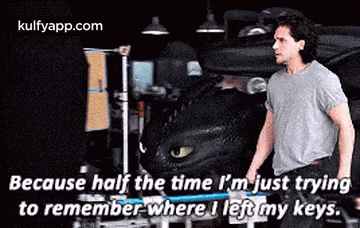 a man is standing in front of a car with a toothless dragon behind him and a quote .