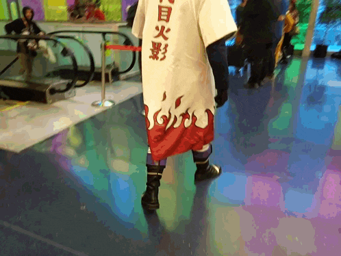 a person wearing a costume with chinese writing on the back