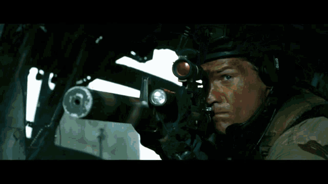a man in a helmet is holding a sniper rifle with the word gto on the front