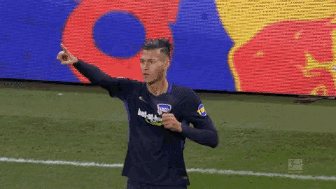 a soccer player wearing a jersey that says barcelona on it