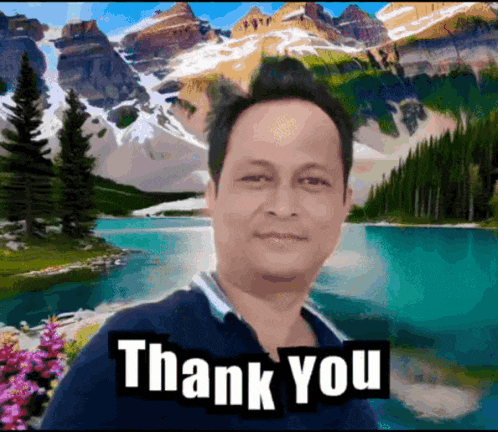 a man says thank you in front of a mountain range