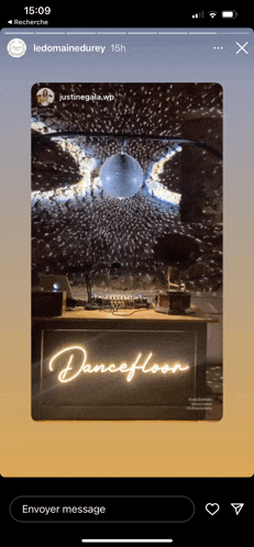 a phone screen shows a dance floor sign