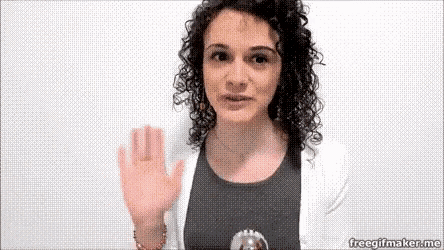 a woman with curly hair waves her hand in front of a white background .