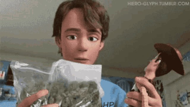 a boy holding a bag of marijuana next to a toy story woody doll