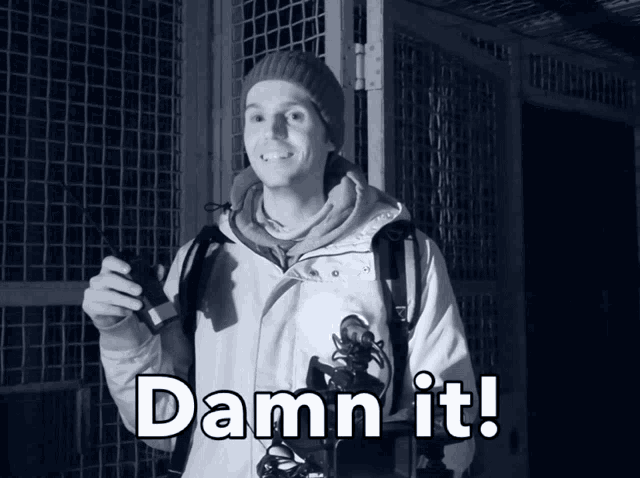 a man holding a walkie talkie with the words " damn it " above him