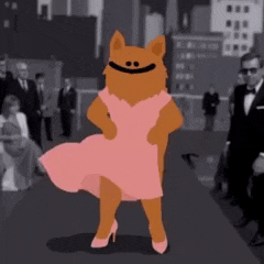 a cat wearing a pink dress and high heels