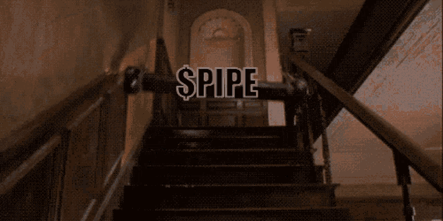 a staircase with a sign that says ' spire ' on it