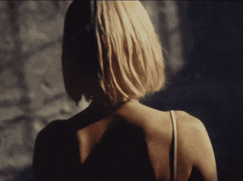 a woman 's back is shown in a blurry photo