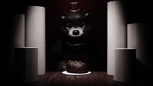 a black and white photo of a teddy bear surrounded by stacks of paper plates