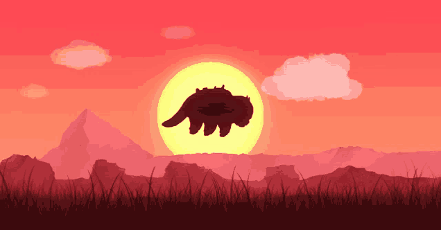 a sunset with a silhouette of a flying animal in the foreground