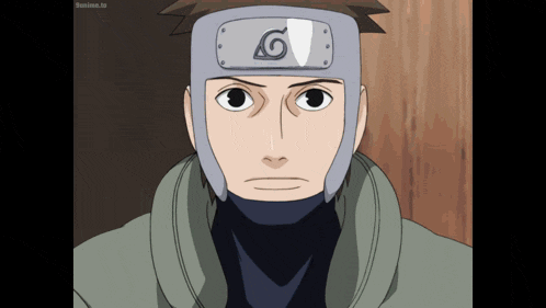 a man wearing a headband with the letter g on it is looking at the camera