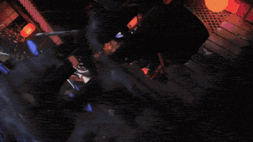 a pepsi can is being smashed by a person