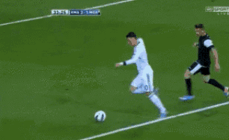 a soccer goal with an ad for adidas in the background