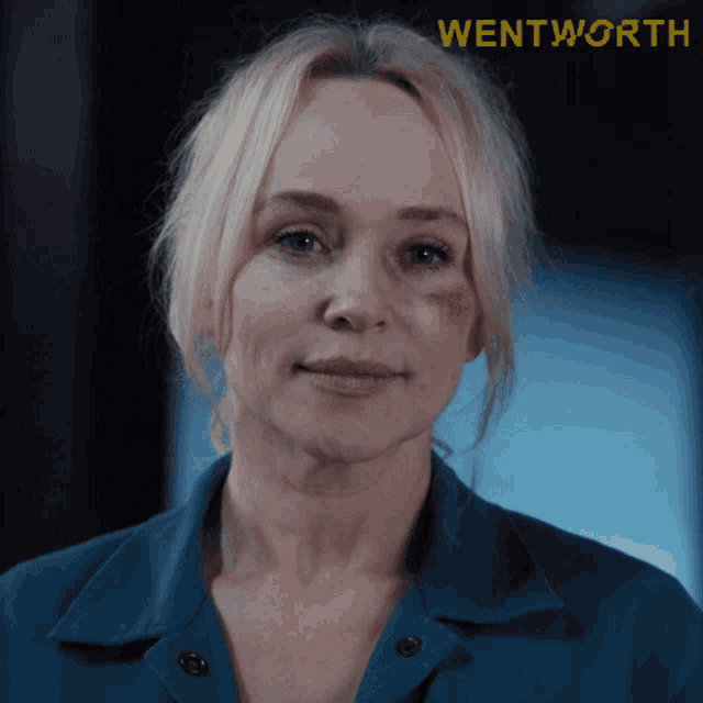 a close up of a woman 's face with the word wentworth in the upper right corner