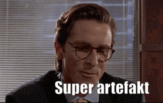 a man wearing glasses and a suit has the words super artefakt written on his face