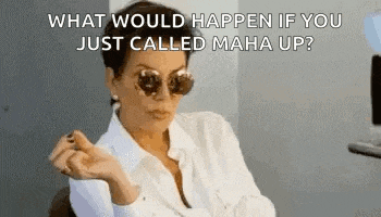 a woman wearing sunglasses and a white shirt is sitting in a chair and smoking a cigarette .