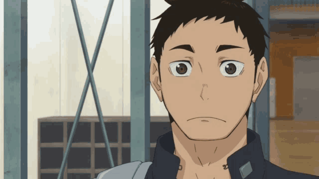 a close up of a man 's face with a serious expression