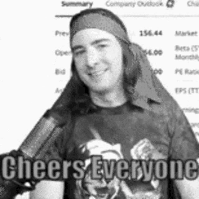 a black and white photo of a man wearing a headband and a cheers everyone shirt
