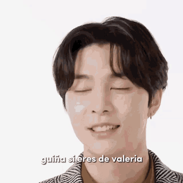 a close up of a person 's face with their eyes closed and the words guiana sieres de valeria .