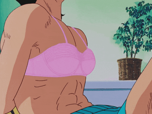 a woman in a pink bra is sitting on a yellow couch