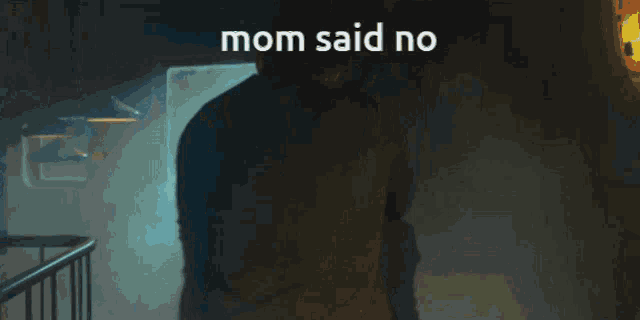 a pixelated image of a man holding another man with the caption mom said no