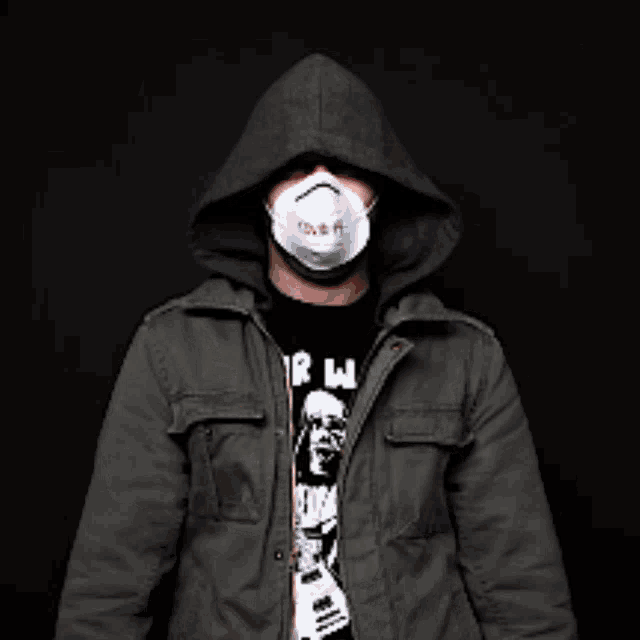 a man wearing a hooded jacket and a face mask with a tn95 on it