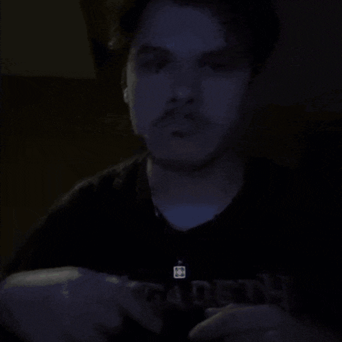 a man is wearing a black shirt that says fadeth