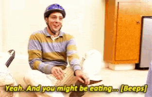 a man wearing a helmet is sitting on the floor and says yeah and you might be eating beeps